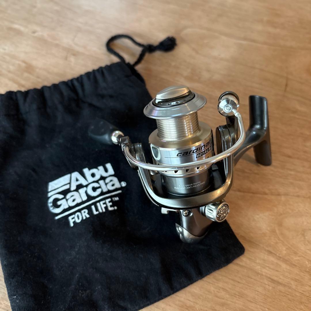 Used Abu Garcia Cardinal 601ALB Reel with Storage Bag