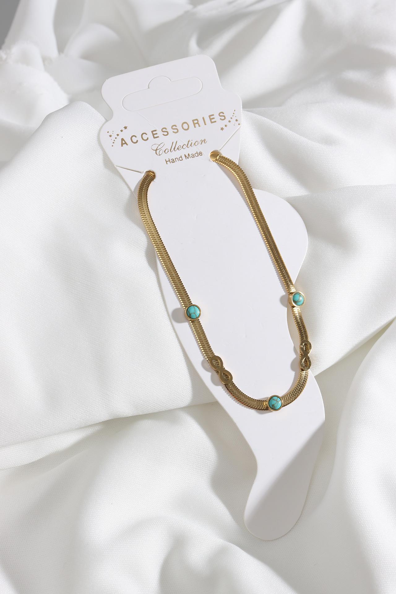 

Итальянский браслет-бесконечность на плоской цепочке из стали золотого цвета