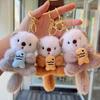 2pcs Fashion Lovely Plush Otters Holding Fish Key Chains Cartoon Cute Otters School Bag Pendant Keyring Funny Toy Student Gifts