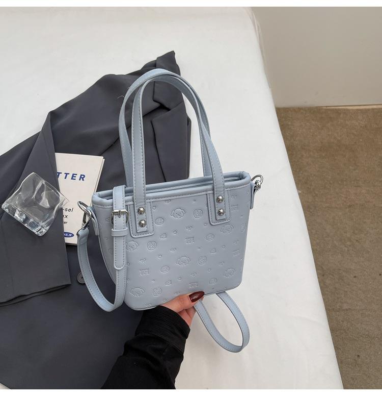 

This year s popular Korean sweet wind cute graffiti embossed portable bucket bag niche design versatile messenger bag women