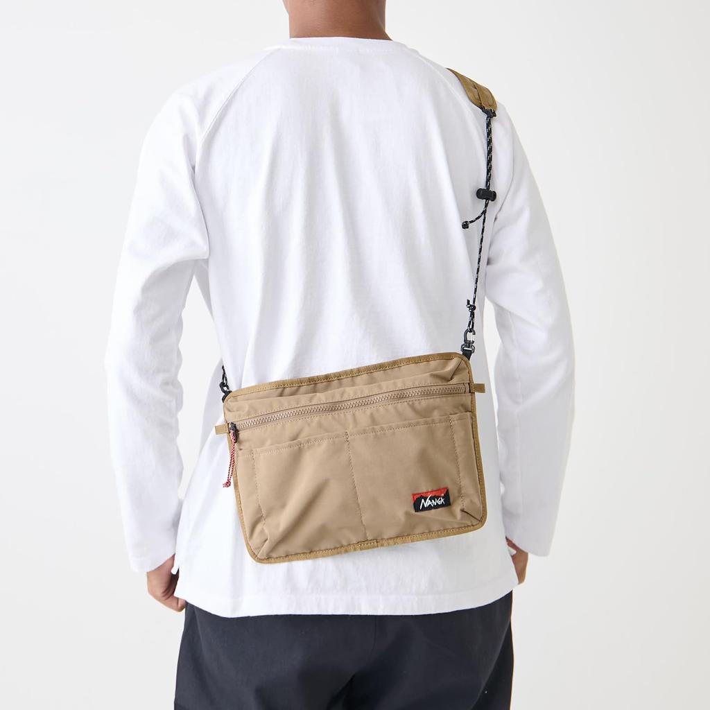 NANGA TAKIBI a unisex shoulder bag for men and perfect for all Made of this bag is perfect for outdoor and SACOCHE, women, seasons. flame-resistant