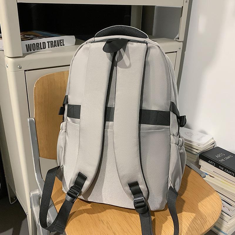 High value trendy cool letter backpack couple contrasting colors simple and lightweight travel mountaineering backpack