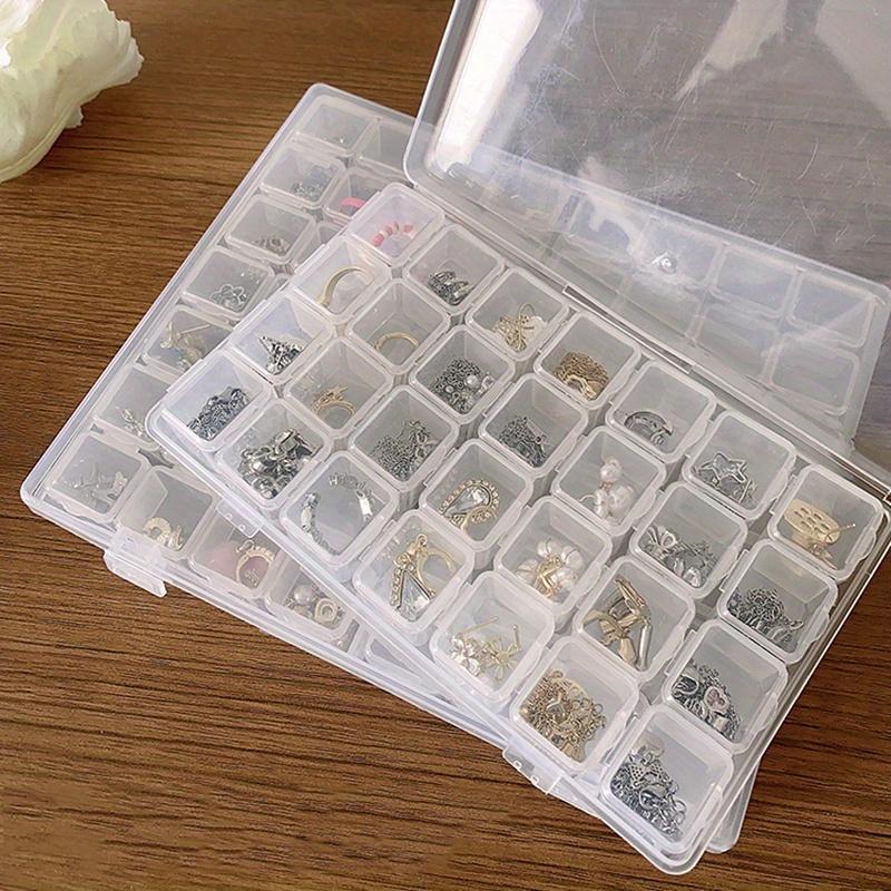 A Transparent Plastic Jewelry Box with 28/56 Compartments for Storing Earrings, Beads, and Crafts.