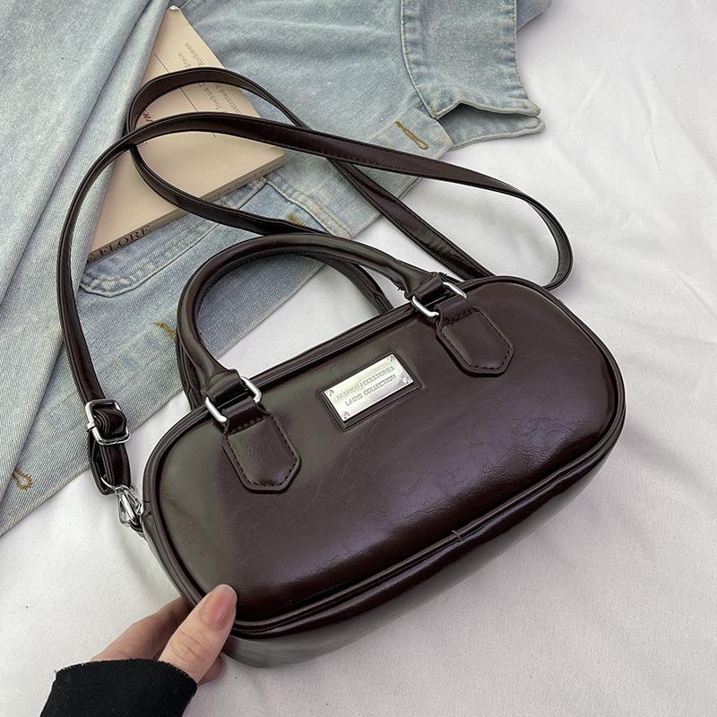 

Новая корейская версия нишевая универсальная сумка для боулинга в иностранном стиле, портативная, женская, для поездок на работу, с продвинутым чувством, сумка-мессенджер, сумка