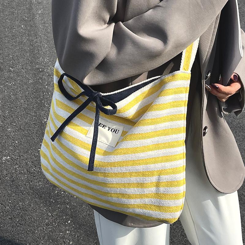 2025 new Korean casual lazy wind contrasting color striped tote bag large-capacity commuter versatile messenger women's bag