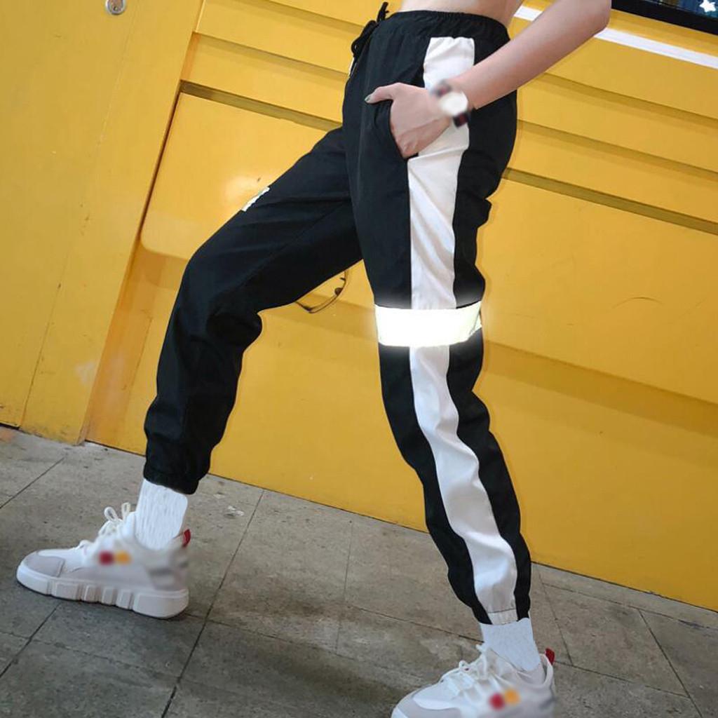 

Мода Женщины Светоотражающая полоса Сращивание Эластичная талия Повседневные свободные леггинсы Брюки