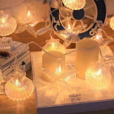 Barevná LED světýlka ve tvaru mušlí a hvězdic pro sváteční výzdobu v interiéru/exteriéru