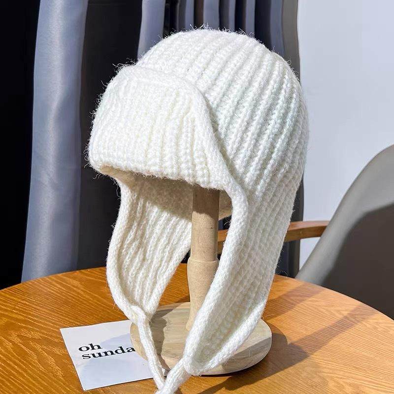 Autumn and winter pink knitted wool hat women's lace-up ear protectors flying hat warm versatile face small ski Lei Feng hat