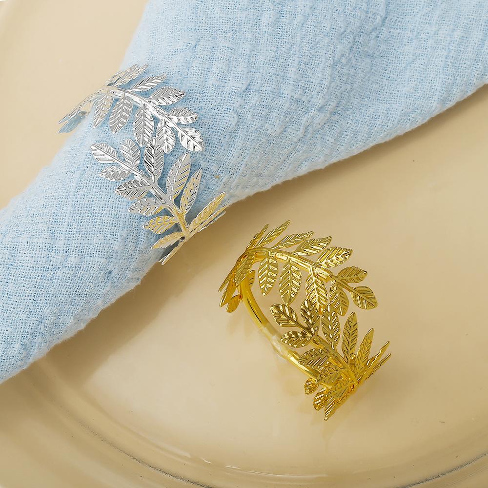 12 ks/lot Nový zlatý simulovaný list kroužek na ubrousky hotelový otevřený kovový držák na ubrousky jednoduchý list kroužek na ubrousky kroužek na ústní utěrku