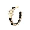 CHANEL metal inlaid leather earrings for women