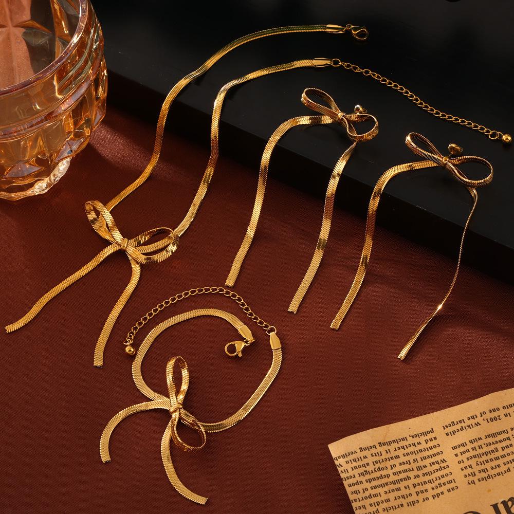 

Trendy Bow Earrings & Jewelry Set: Niche Metal Design