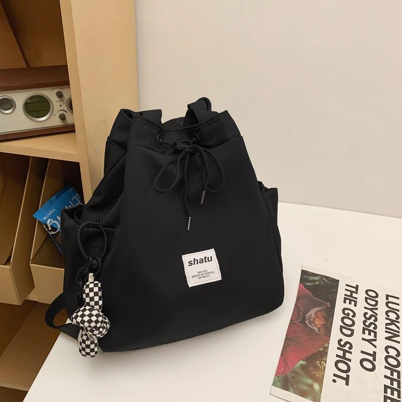 New dual-purpose small backpack, casual niche girlfriend handheld shoulder bag, Japanese and Korean drawstring commuter work backpack
