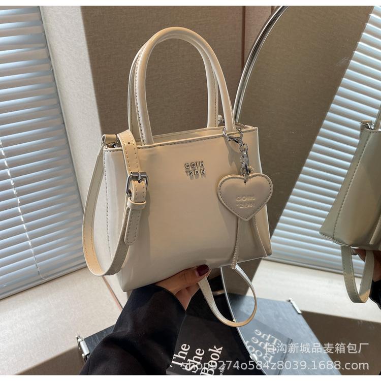 Popular foreign niche design bag women's 2025 new portable bucket bag fashionable commuter shoulder crossbody bag