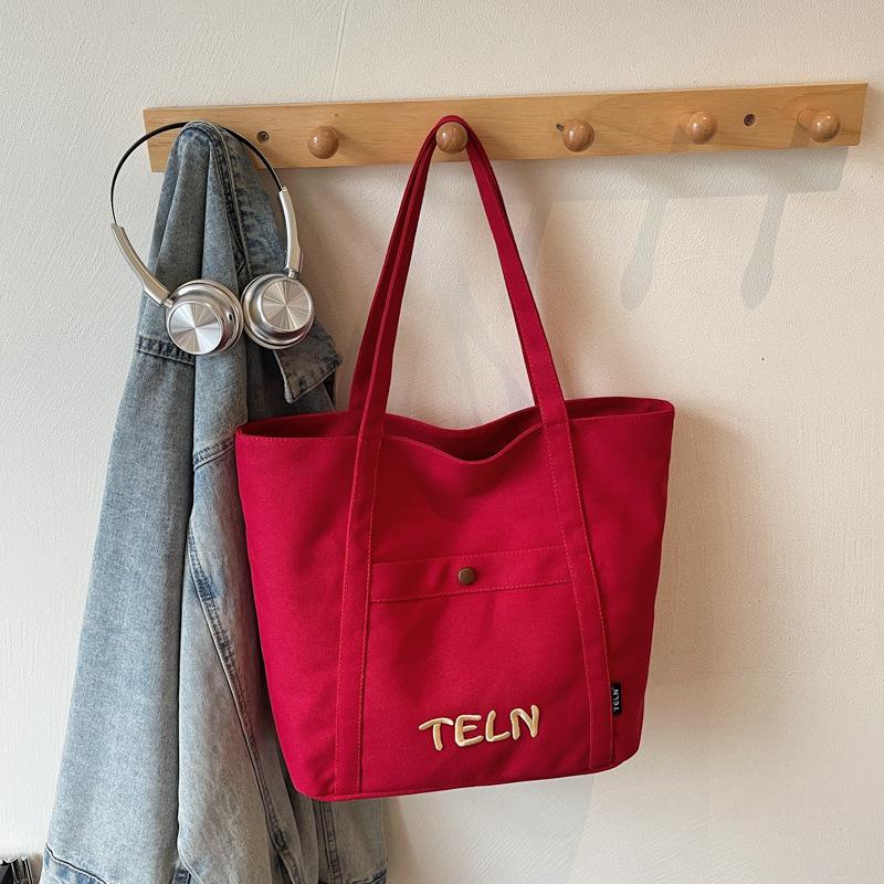 

Large capacity tote canvas canvas bag 2025 autumn new high-value commuter literature and art student wear shoulder bag бордовый