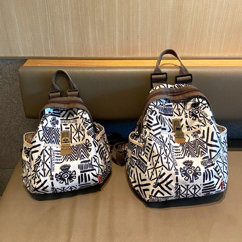 

Hong Kong Genuine Goods Fashion Brand South Korean Silk Lightweight Large Capacity Backpack Women Fashion Backpack Niche Leisure Travel Schoolbag Draw like medium + smiley face pendant