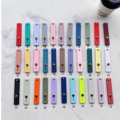 Silicone Push-Pull Phone Stand: Solid Color, Portable, Adhesive, Adjustable.