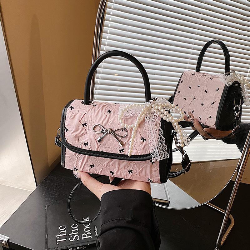 

Korean version niche bow bag women s 2025 new shoulder messenger bag high-end polka dot portable small square bag Single Pack