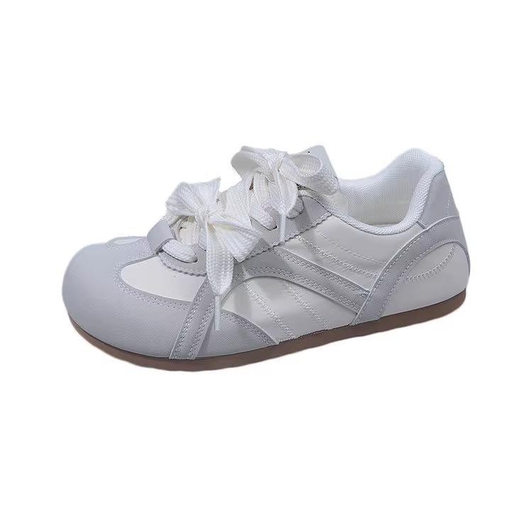 

Bow puff little white shoes women s niche original design 2025 new board shoes popular chic lightweight German training shoes 35