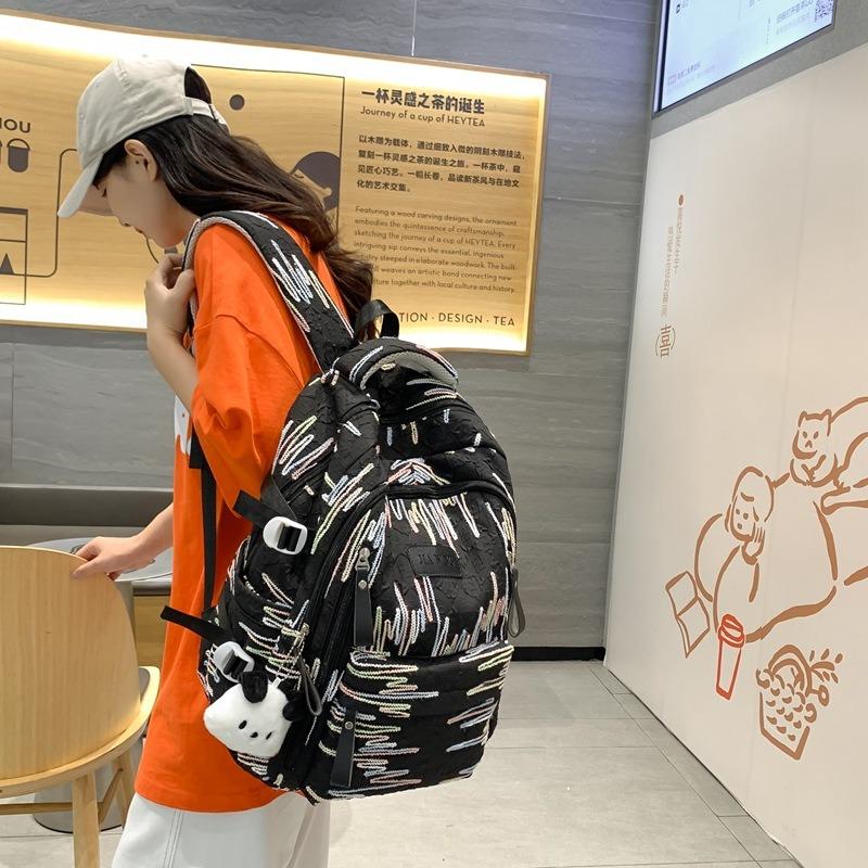 New Large-capacity Backpack, Popular Burden-reducing Schoolbag for Junior High School and High School Students, College Student Women's Travel Bag.