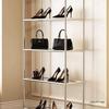 Stainless Steel Multi-Layer Floor Rack for Clothing, Bags, Shoes, and Hats.