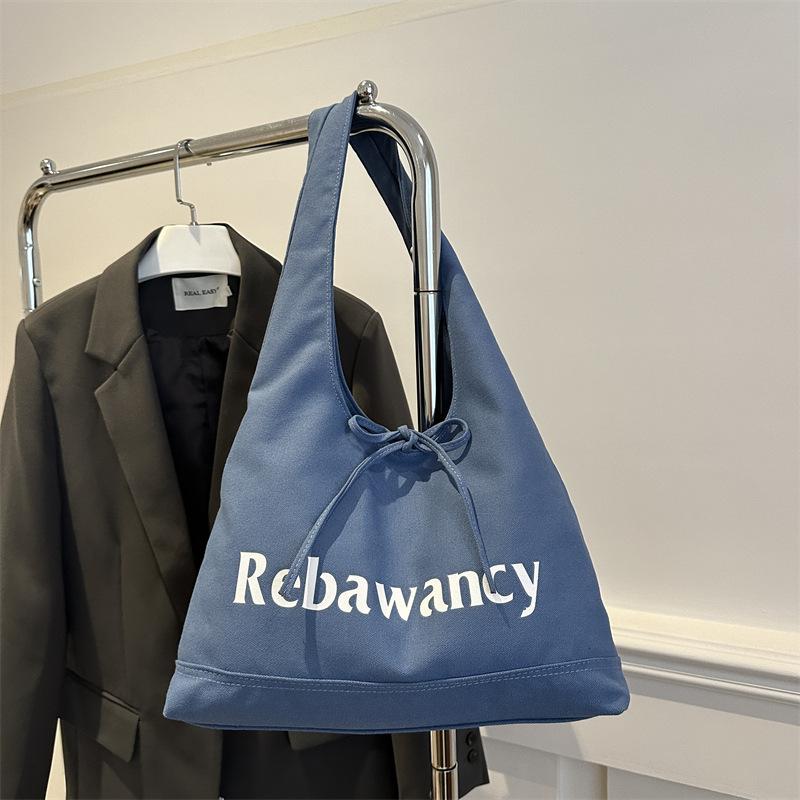 

Korean large-capacity canvas bag women s 2025 new fashion letter casual shoulder bag versatile niche tote bag