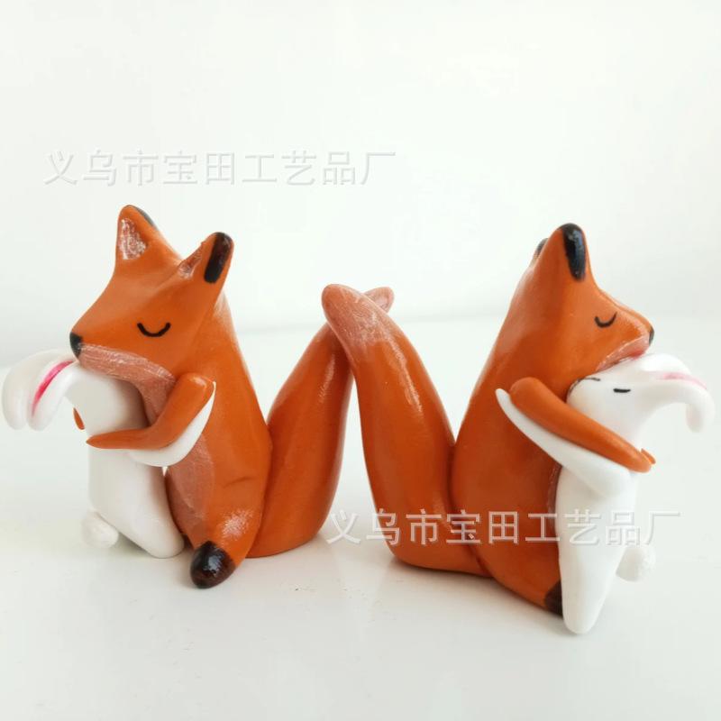 A fox and bunny with love hug home cartoon mini resin figurine ornament