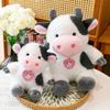 Plush Cow Childrens Doll With Pendant Design And Sitting Pose For Holiday Gift