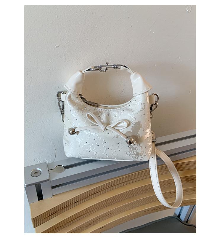 

Foreign style bow hand carry small bag women 2025 new Korean version niche portable cloud bag fashion messenger bag tide
