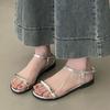 Flat-bottomed silver sandals for women's summer wear 2025 new versatile skirt metal buckle one-word beach Roman shoes