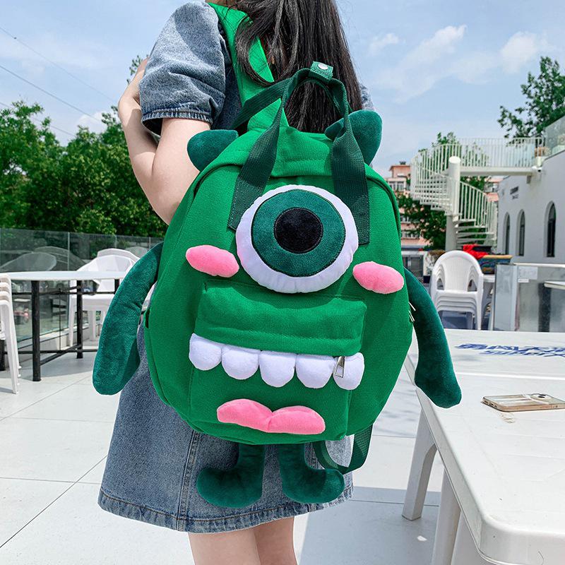 Women's Cute Four-Legged Monster Canvas Backpack - Fashionable, Large Capacity for Travel and School.