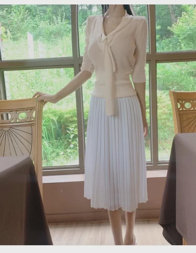 Koreanischer Dongdaemun Slim Fit Strickpullover mit halblangen Ärmeln und Schleifendesign für Damen