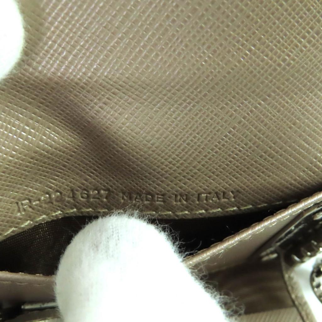 Excellent Porte-clés Salvatore Ferragamo Cuir Doré Champagne Femme 224627 Occasion