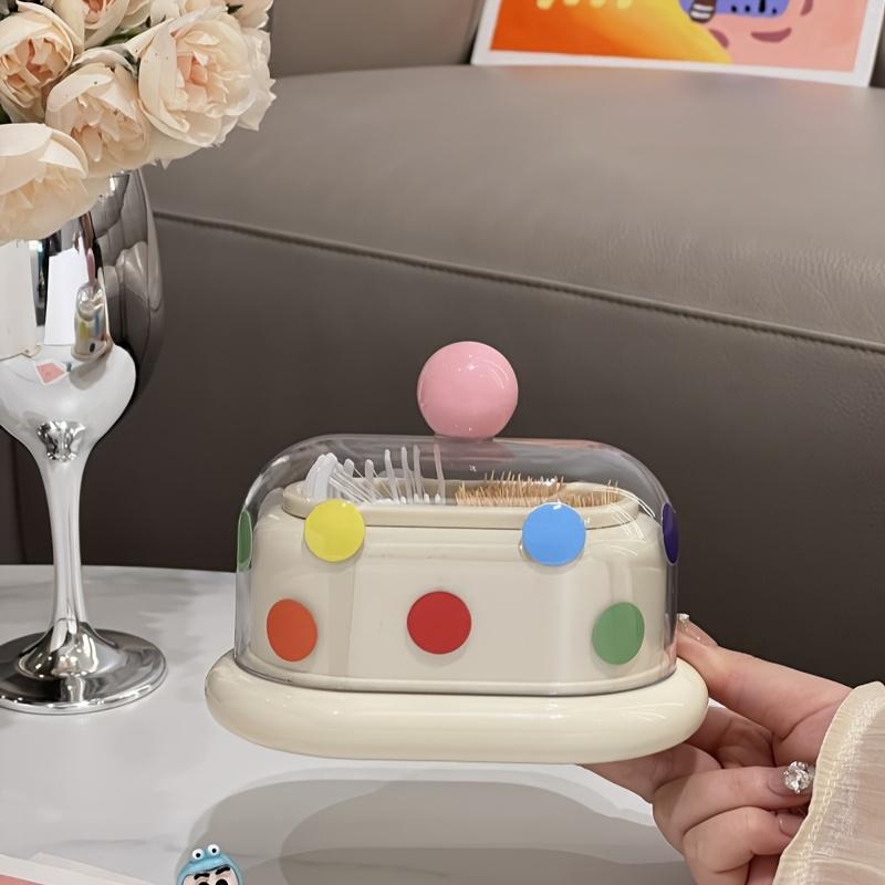 

Этот дизайн зубочистки одновременно милый и элегантный. Это новая коробка для хранения ватных палочек, диспенсер для зубочисток, прозрачная коробка для хранения в ванной комнате