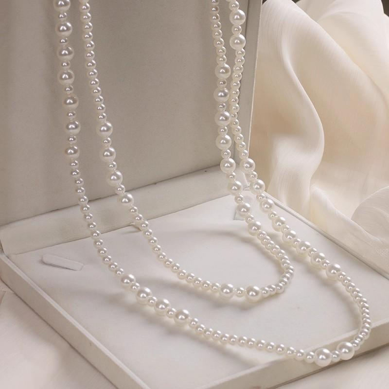 Hepburn style long stacked pearl necklace women's sweater chain temperament advanced sense light luxury niche 2025 new explosion