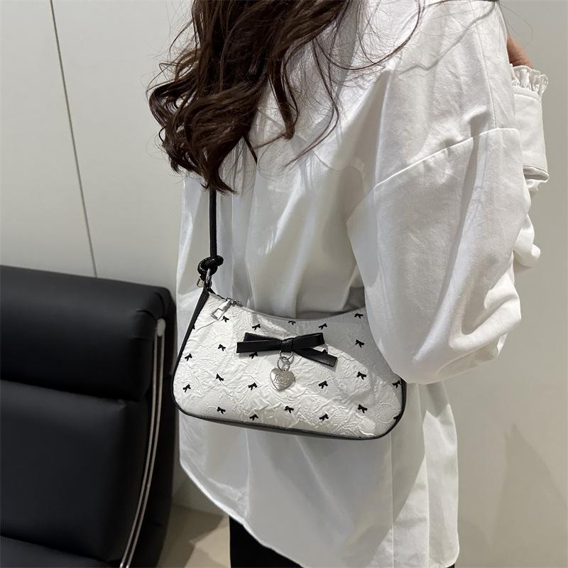 Pink bow crescent armpit bag women's summer 2025 new fashionable versatile texture light luxury shoulder small square bag