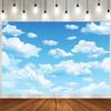 A blue polyester fabric background curtain in the sky with white clouds, and a multi-functional party decoration banner