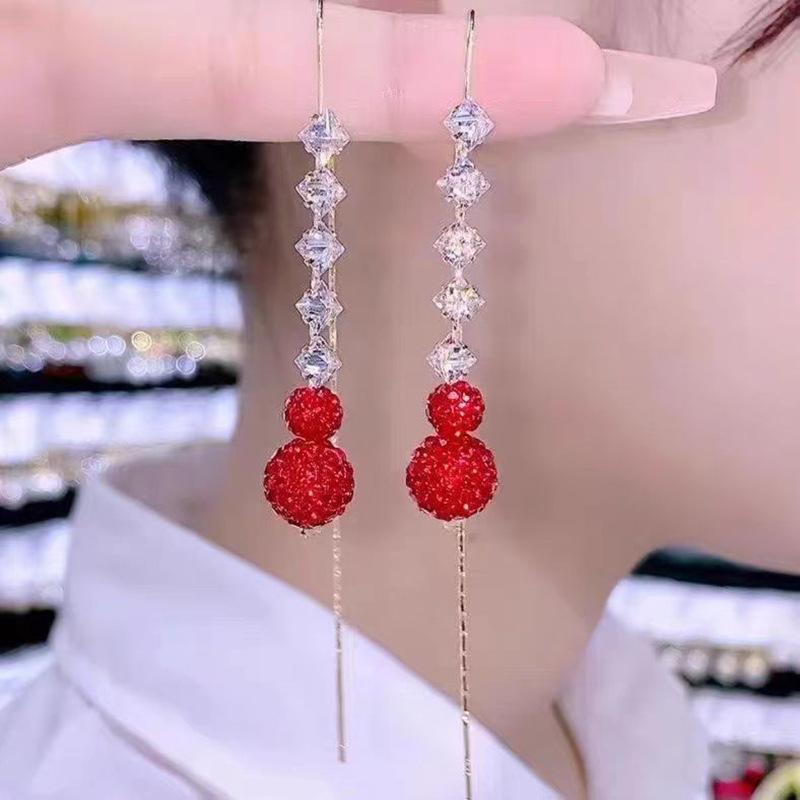 

Серьги-кисточки из красной тыквы красный