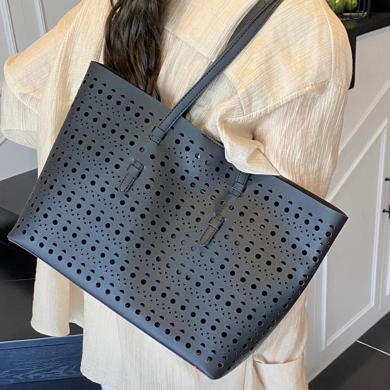 2025 spring and summer new niche high-end hollow tote bag large-capacity temperament commuting single shoulder child and mother bag