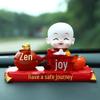 Creative Little Monk Maitreya Buddha Car Ornament: Cute, Shaking Head Resin Doll for Car Interior Decoration and Safety.