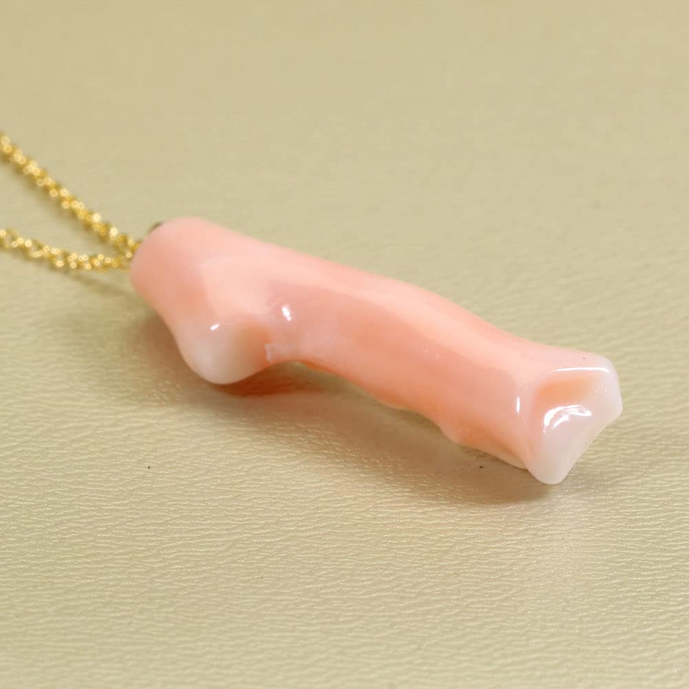 Undyed pink garnet coral branch pendant necklace.