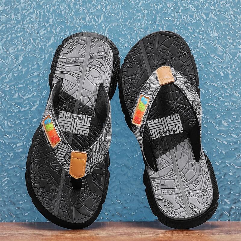 Fashion Men's colorful - pattern flip - flops. Upper with label, two - toned soles. Stylish, casual design. Comfortable & versatile.