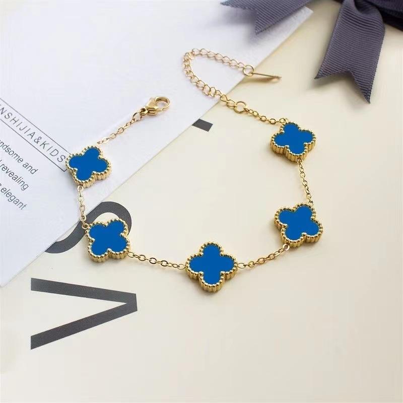 Bracciale da donna a fascia con conchiglia double-face e quadrifoglio, resistente ai colori, alla moda e di alta gamma