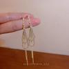High-End Heart Tassel Earrings: Slimming, Long Dangle for Round Faces - Luxurious and Niche Design