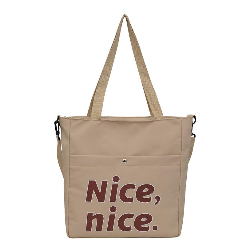 Stijlvolle studententote bag met grote capaciteit, nieuwe handtas met textuur, trendy schouder-okseltas.