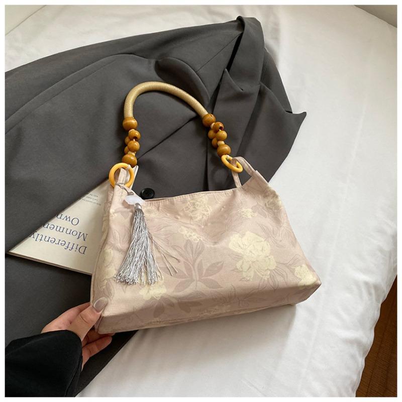 

New bag women s niche embroidered shoulder bag large capacity fashion portable bucket bag