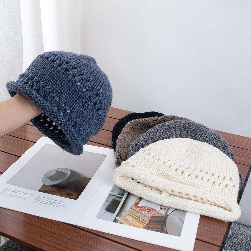 Solid color crimped hollow knitted headgear women's autumn new versatile wool hat loose pullover cold hat