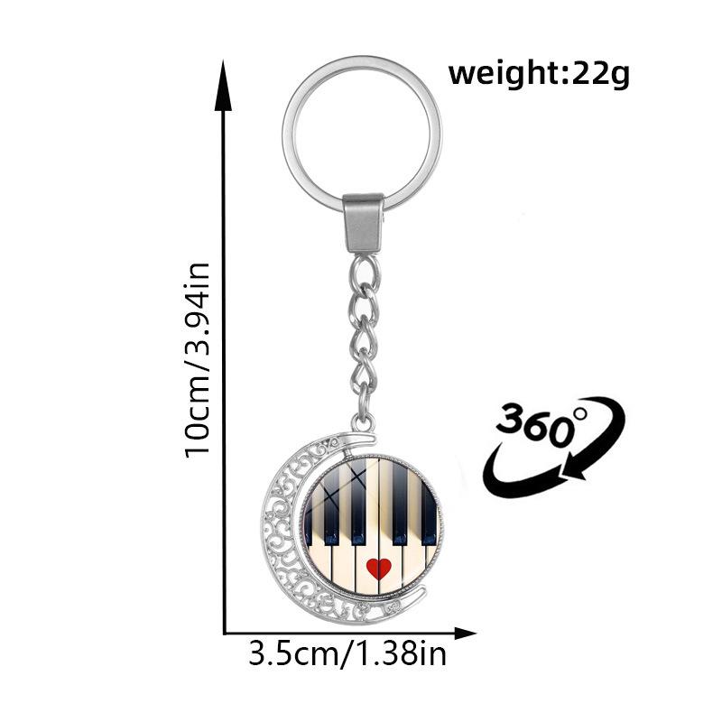 Heart-Shaped Rotating Piano Key Pendant Keychain with Gem and Musical Notes Ornament