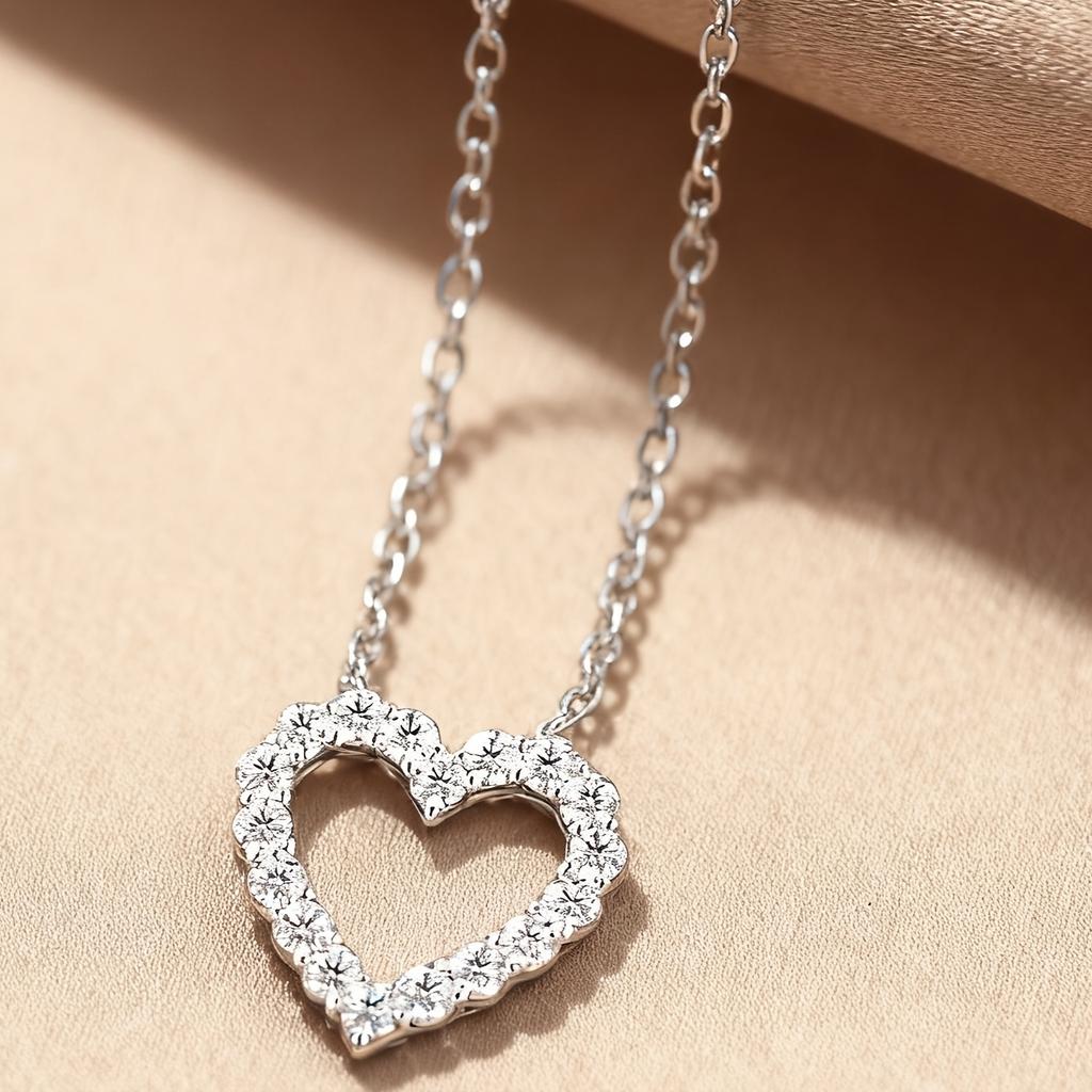 A Pendant Necklace for Women with a Rhinestone-embellished Hollow Heart Design for Valentine's Day