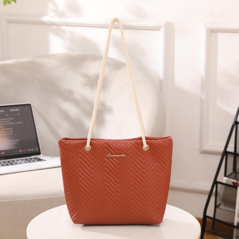 

Simple rope shoulder strap portable tote bag fashionable personality wave embossed shopping bag large capacity shoulder bucket bag світло-коричневого кольору