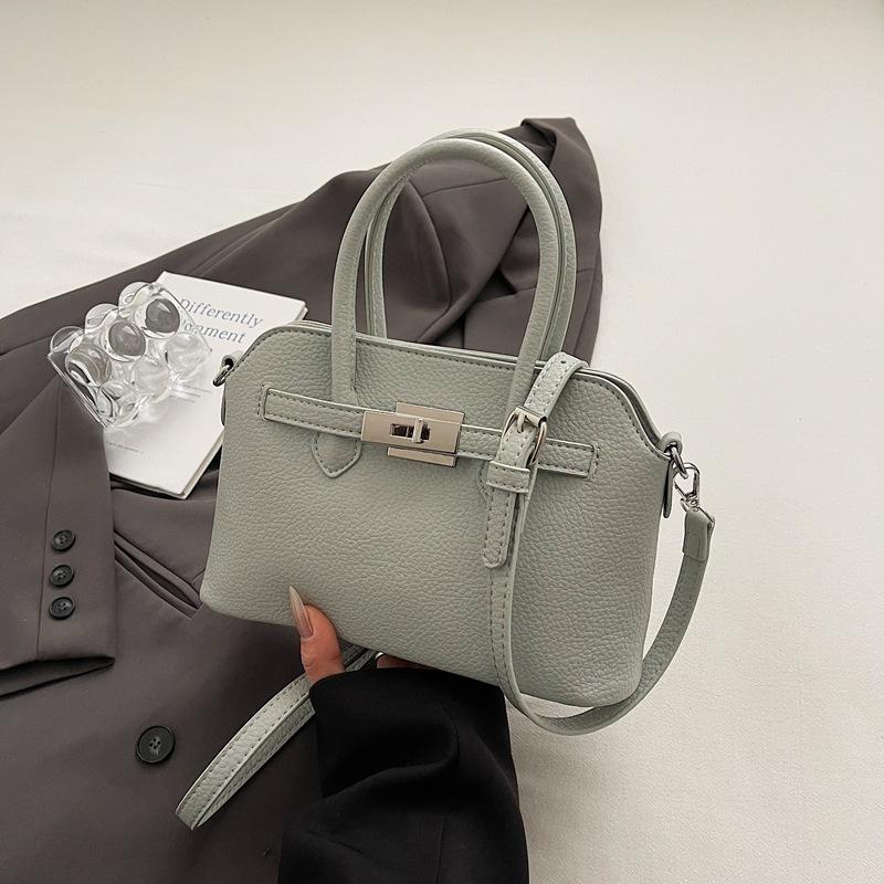 Simple temperament hand bag women's spring new niche fashion messenger bag commuter shoulder bag